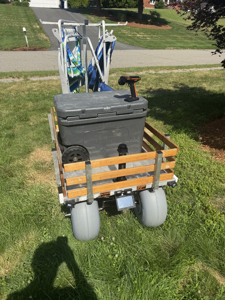 Rear view of the loaded cart with the remote on the cooler lid