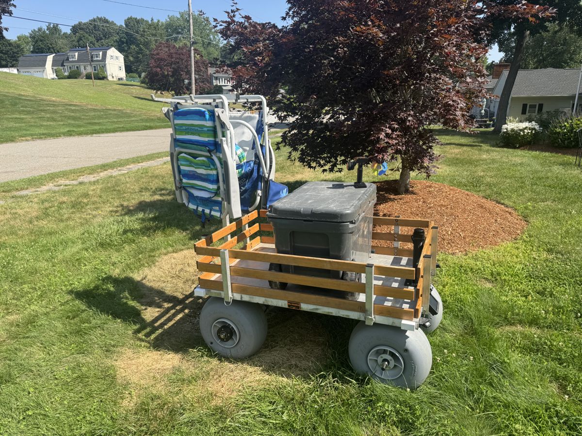 Side view of the cart parked with chairs and cooler loaded